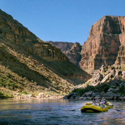 Yellow OARS rafts in lower section of Grand Canyon