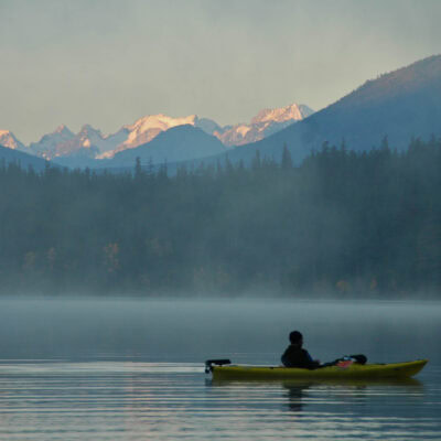 Calm misty morning on a lake in Canada.