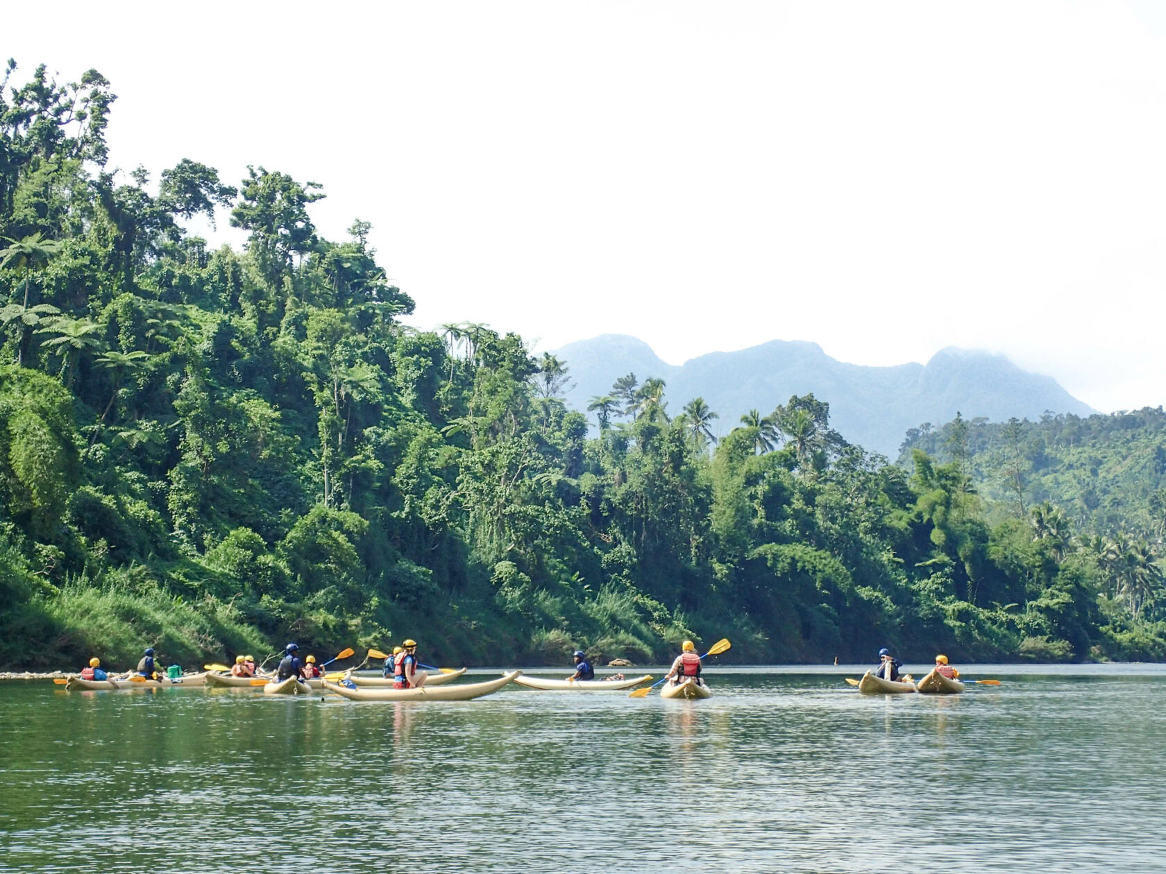 Group rafting down a river in Fiji.