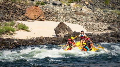 An OARS raft goes through a rapid on the Lower Salmon River