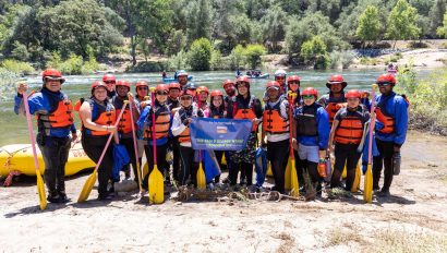 A group of rafting guests and OARS guides stand ready for a rafting trip on the South Fork of the American River